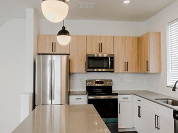 Light Open Kitchen with Energy Efficient Appliances at The Austin Townhomes, Draper, UT 84020